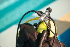 Oxygen tank at the poolside, scuba gear