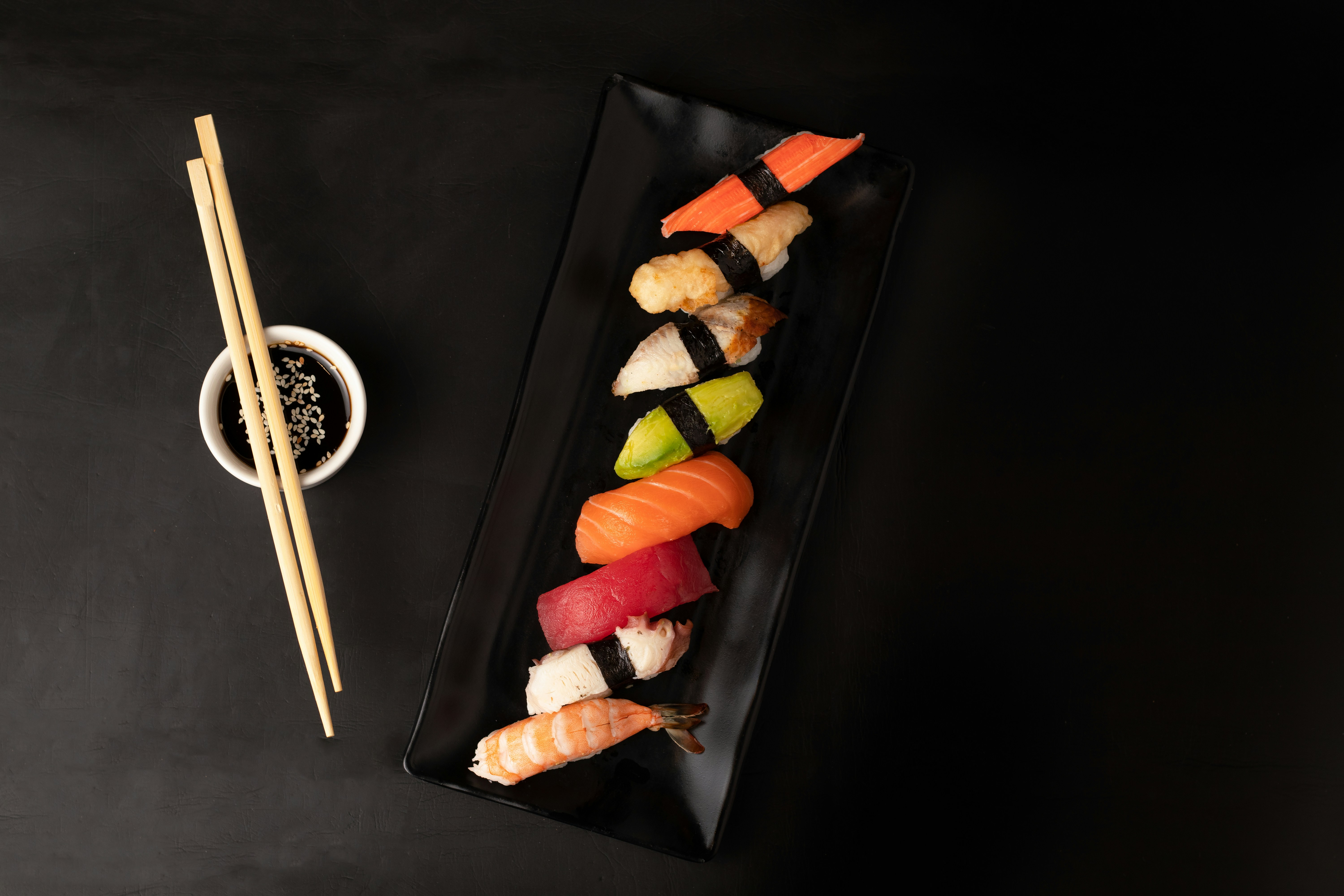 sushi on black square plate