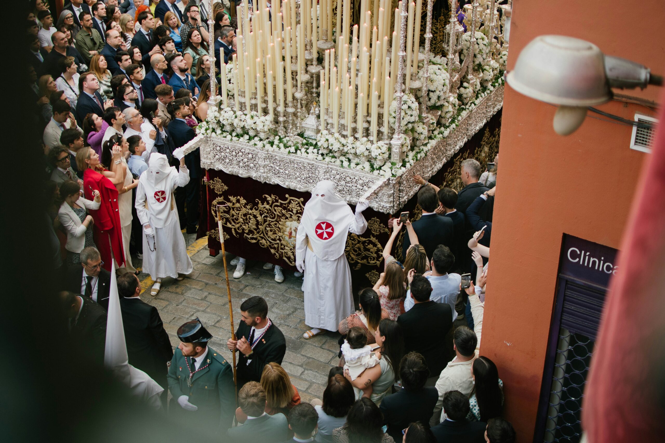 Procession with many people and religious iconography.